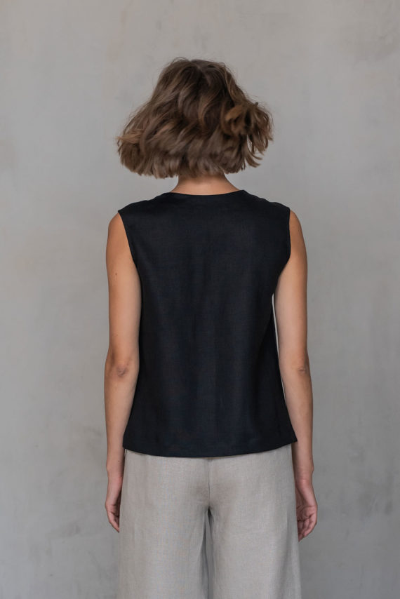 Back view of the V-Neck Linen Sleeveless Blouse, showcasing the smooth linen fabric and tailored fit.