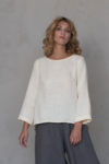 Front view of the Linen Blouse with Back Pleat ROSE in Elephant Bone, showcasing its minimalist design and relaxed fit