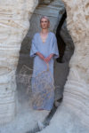 Front view of a woman wearing the Women's Oriental Galabeya Dress MIDBAR in natural linen