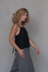 Side view of the Open Back Linen Top TULUM showcasing the flowing fit and adjustable straps for a custom look.