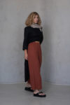 Front view of the YANK Cropped Linen Pants, showing the relaxed fit and minimalist design with no side seams or pockets