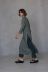 Model walking in the Linen Tunic Dress KAYLO, with high side slits offering both style and breathability.