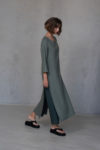 Model walking in the Linen Tunic Dress KAYLO, with high side slits offering both style and breathability.