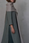 Natural flax gauze linen scarf draped elegantly over a green dress.