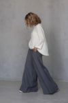 Side view of the AGAM Linen Palazzo Pants, highlighting the flowing wide-leg silhouette and full-length cut