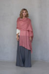 Coral Gauze Linen Scarf draped elegantly over one shoulder, emphasizing its vibrant hue and soft gauze fabric.