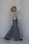 Model wearing the TOM Cropped Linen Jacket, open-front style with slim fit, perfect for light coverage indoors or outdoors