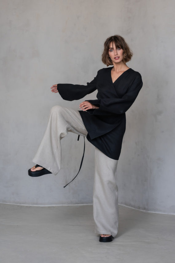 BORA Linen Pants styled with a jacket, demonstrating versatility for casual and elegant layered looks