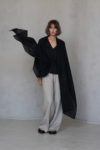 Black Gauze Linen Scarf styled with a dramatic drape, highlighting its breathable and airy design.