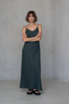 Full-length view of the Bias-Cut Linen Dress VERED in dark green, showcasing its elegant silhouette and lightweight linen fabric.