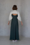 Back view of the Convertible linen bolero, showcasing the dramatic puff sleeves and cropped design in natural linen.