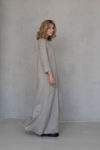 Model twirling in the A-line Maxi Winter Linen Dress, showing off its flowing hemline.