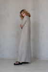 Side view of the A-line Maxi Winter Linen Dress RITA, highlighting the fitted sleeves and graceful silhouette