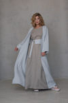 Model wearing the URSA Long Linen Abaya, showing the open-front design and relaxed fit, perfect for layering