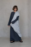 Folded light blue gauze linen scarf, highlighting its soft texture and tranquil hue.