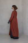 Side view of the KRIS Long Linen Coat, showcasing the ankle-length cut and natural drape of 100% linen fabric