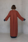 Back view of the KRIS Linen Coat, showcasing the ankle-length cut and natural drape of 100% linen fabric