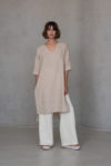 V-neck linen tunic RONA in elegant elephant bone color, featuring 2/3 sleeves, high-low hemline, and stylish side slits for a contemporary minimalist look.