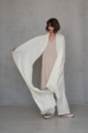 Unisex Ivory Gauze Linen Scarf casually styled, capturing its very special fabric and pleasant feel against the skin.