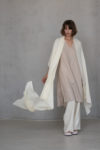 Unisex Ivory Gauze Linen Scarf in motion, capturing its airy texture, elegant design, and versatility