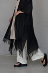 "Boho fringed linen cover in white, perfect for beachwear or casual outings."