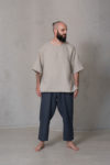 Men’s loose fit cropped pants ZEN in natural flax color, featuring a wide elastic waistband, side pockets, and a relaxed silhouette.