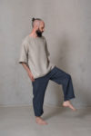 Side view of men’s cropped pants ZEN highlighting the breathable fabric, relaxed fit, and minimalist design with side pockets