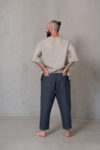 Back view of men’s cropped pants ZEN showcasing the back pockets, wide elastic waistband, and cropped length for effortless style