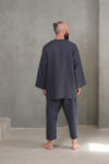 A back view of the men's open-front linen jacket, highlighting the medium weight fabric and long sleeve silhouette.