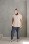 Lightweight unisex linen top paired with dark pants, showcasing a relaxed and timeless aesthetic.