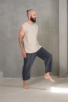 sleeveless linen top styled with tailored dark pants, demonstrating its versatility for modern wardrobes.