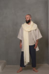 Unisex Ivory Gauze Linen Scarf worn as a shawl, highlighting its incredible fabric and soft, flowing drape.