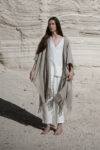 A full-body view of a natural flax Linen Jacket with Fringes