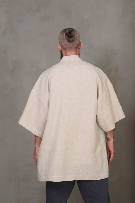 Back view of the linen kimono jacket showcasing its relaxed fit and lightweight material, ideal for summer wear.